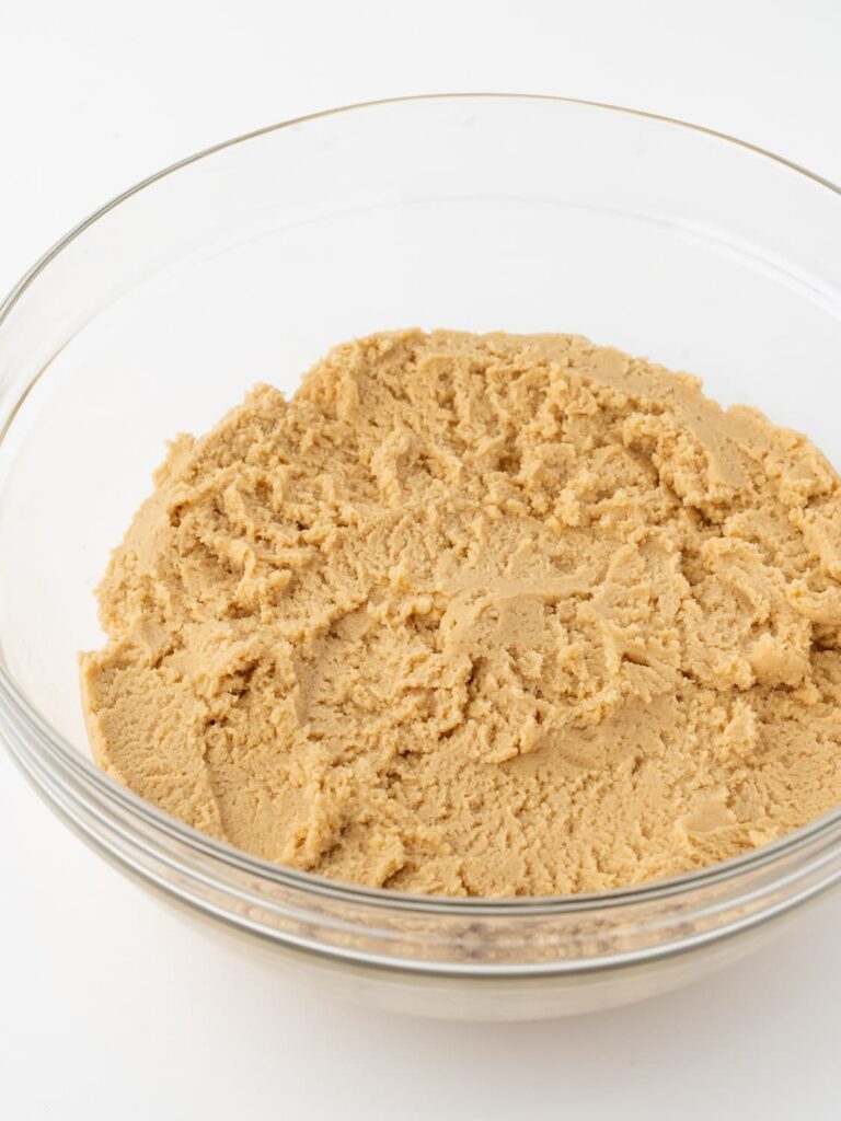 Peanut butter cookie dough in a mixing bowl.