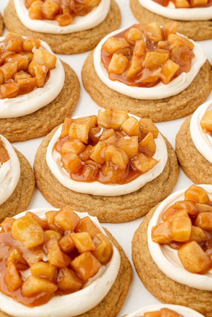 Soft cinnamon brown sugar cookies with salted caramel buttercream and a spoonful of tender cinnamon apples.