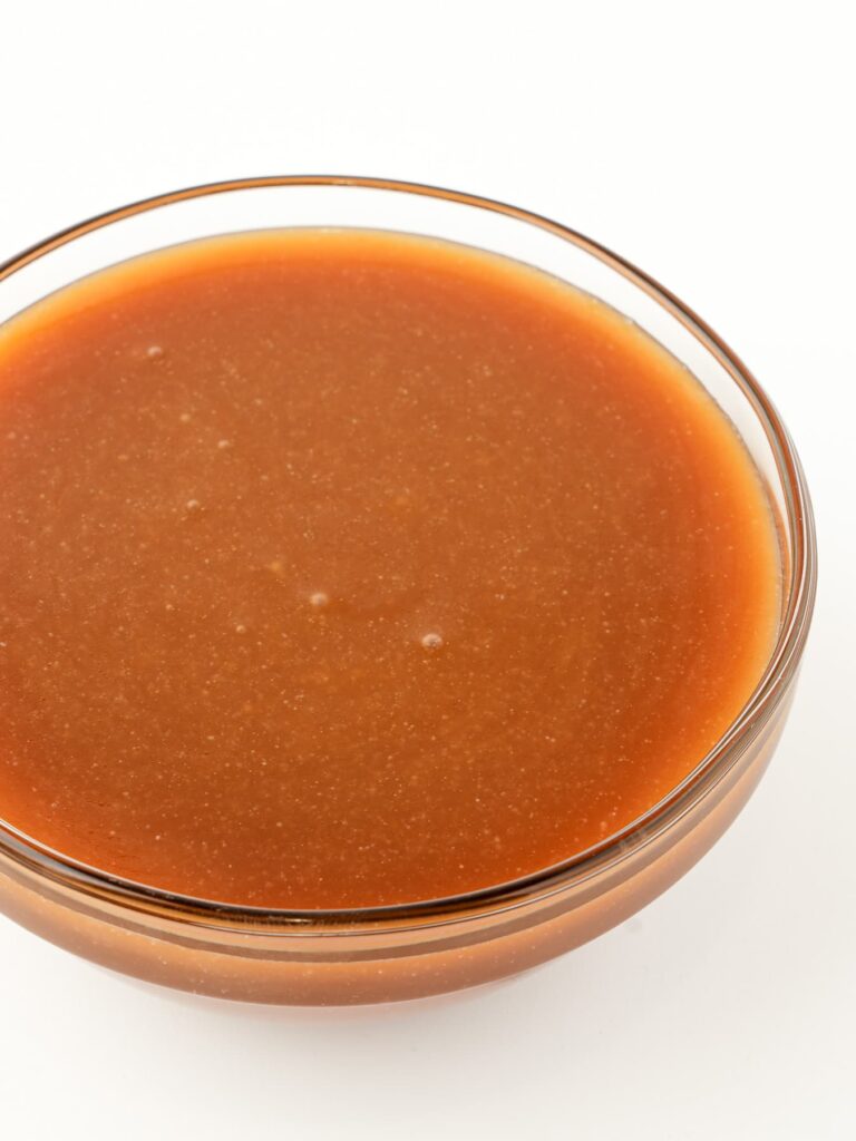 Homemade salted caramel sauce cooling in a bowl.