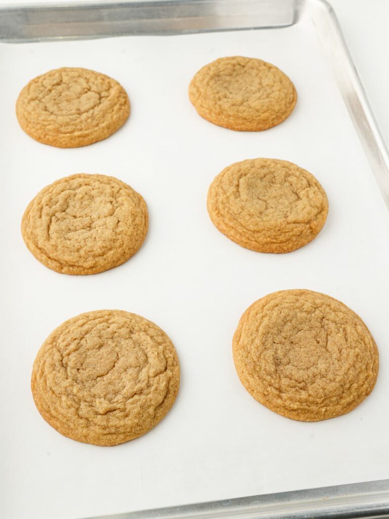 Freshly baked cinnamon brown sugar cookies with set edges and soft centers.