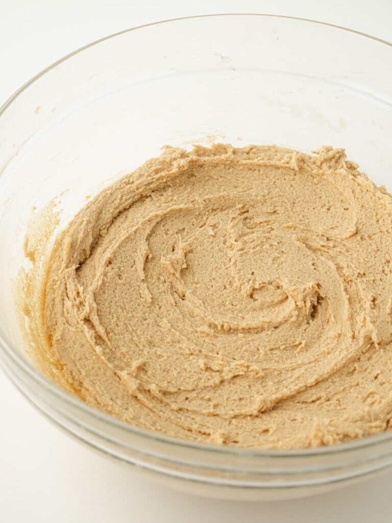 Cinnamon brown sugar cookie dough mixed together in a mixing bowl.